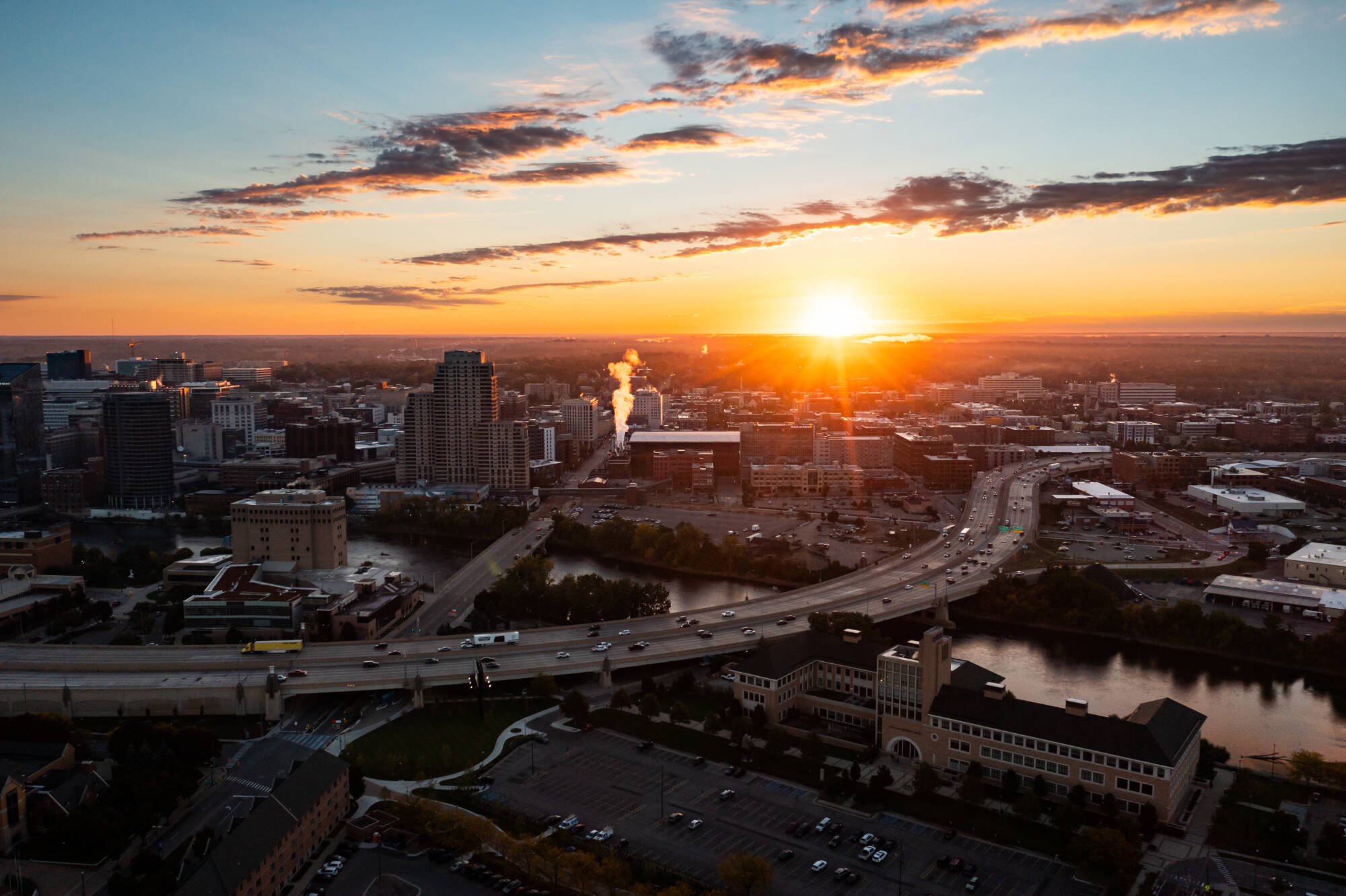 GVSU Pew Campus in the Grand Rapids skyline at sunrise.